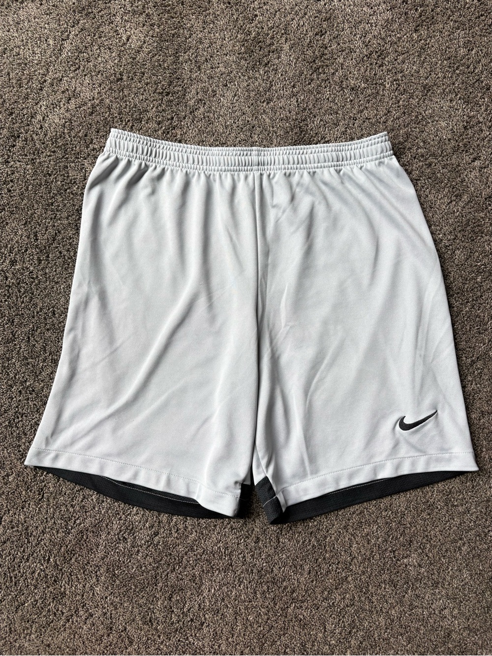 Nike Men’s Light Gray Athletic Shorts with Black Swoosh Accent